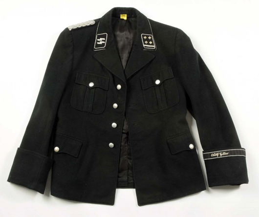 Tunic for Nazi SS lieutenant colonel, with SS tag in left pocket and cuff tag bearing the name ‘Adolph Hitler,’ paired with trousers that appear to be original, est. $5,000-$10,000. Morphy Auctions image