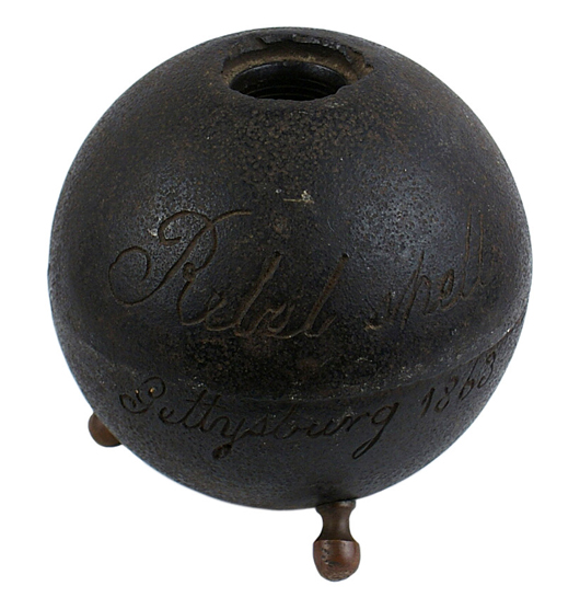 Confederate cannonball from the Battle of Gettysburg (1863), mounted on three brass leg finials ($5,850). Mohawk Arms image