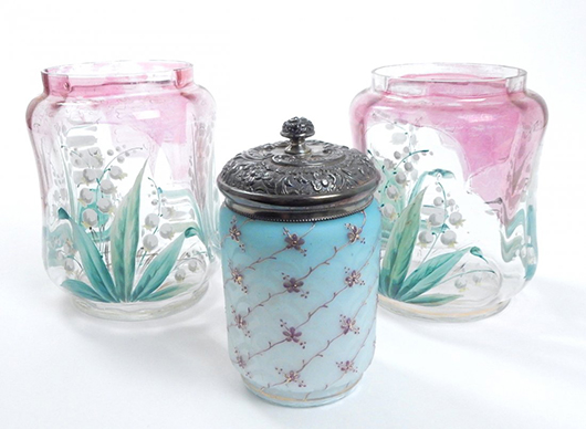 One of the West Virginia sites undergoing redevelopment is the former Fostoria Glass Company plant in Moundsville. Fostoria produced beautiful colored glass as seen in this pair of painted jars (background) and pickle jar (foreground). The group lot is entered in Roland's July 26 auction with an estimate of $150-$200. Image courtesy of LiveAuctioneers and Roland Auctioneers and Valuers