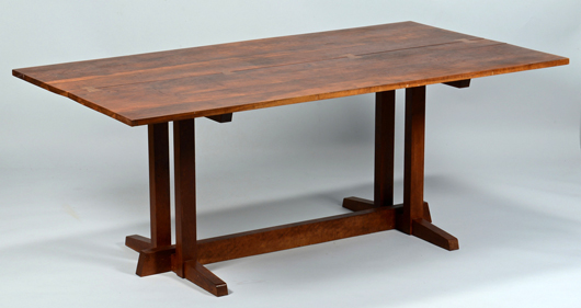 A George Nakashima 'Frenchman’s Cove #2' cherry dining table leads a selection of midcentury modern furniture and accessories. Est. $8,000-$10,000. Case Antiques image