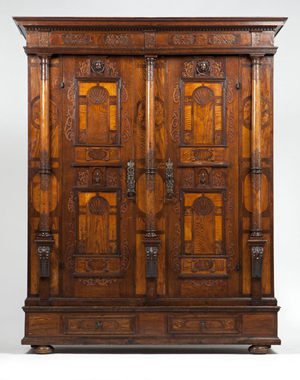 Estimated to bring $7000 to $10,000, this Continental armoire is richly veneered with oak, elm, and burl walnut, among other woods. John Moran image