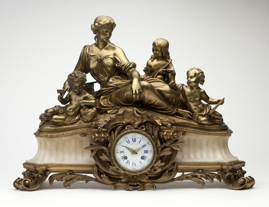 One of a number of quality consignments handpicked from an important Montecito estate, this Napoleon III gilt bronze and marble mantel clock is surmounted by children representing the arts, and a reclining female figure. Estimate: $2000-$3000. John Moran image