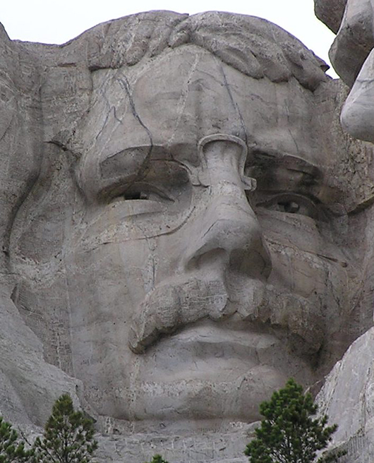 Closeup of Theodore Roosevelt's visage on Mt. Rushmore National Memorial, Keystone, South Dakota. Photo by Scott Catron, licensed under the Creative Commons Attribution-Share Alike 3.0 Unported license.