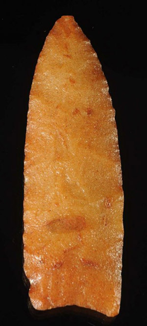 Translucent orange sugar quartz clovis point, early Paleo, 10,500-8,000 years old, likely origin Wisconsin. Image courtesy LiveAuctioneers.com Archive and Morphy Auctions.