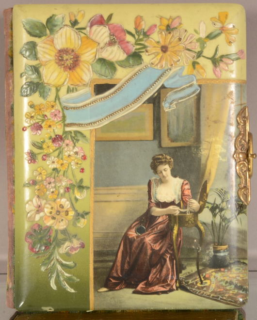 'Admiring Her Treasures' photo album, circa 1900. Bruhns Auction Gallery image.