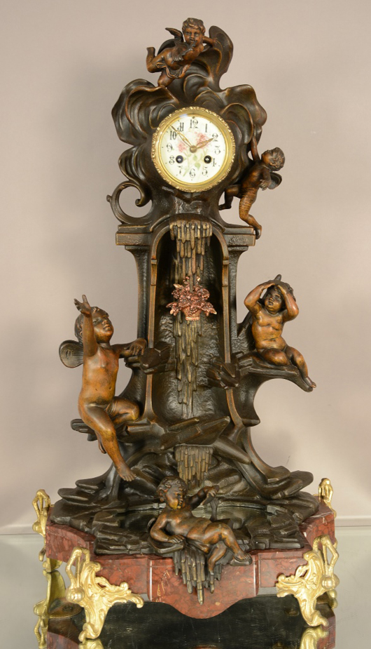 French Louis XV-style figural mantel clock, circa 1875. Bruhns Auction Gallery image.