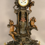 French Louis XV-style figural mantel clock, circa 1875. Bruhns Auction Gallery image.