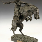 ‘Bronco Buster’ bronze sculpture by Frederic S. Remington, signed and stamped by Roman Bronze Works and marked #75. Thomaston Place Auction Galleries image.