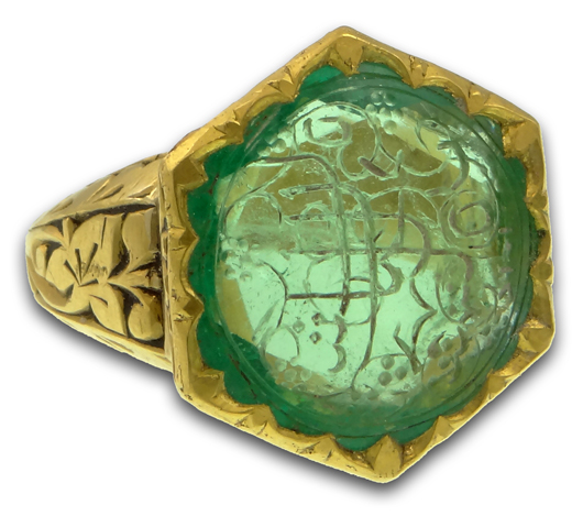 Mughal-style bezel set, approximately 10.30-carat emerald with carved Arabic inscription set in 22K yellow gold ring. Price realized: $16,520. Kodner Galleries image.