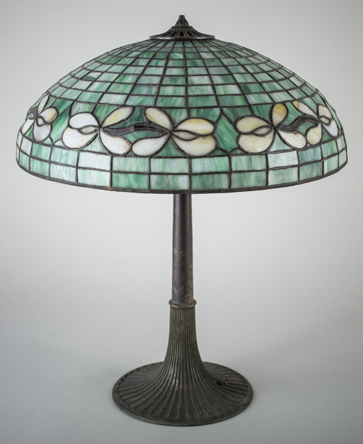 Blue-green slag glass lamp with pink flower border, standing 21 1/2 inches high, sold for $1,975. Capo Auction Fine Art and Antiques image.