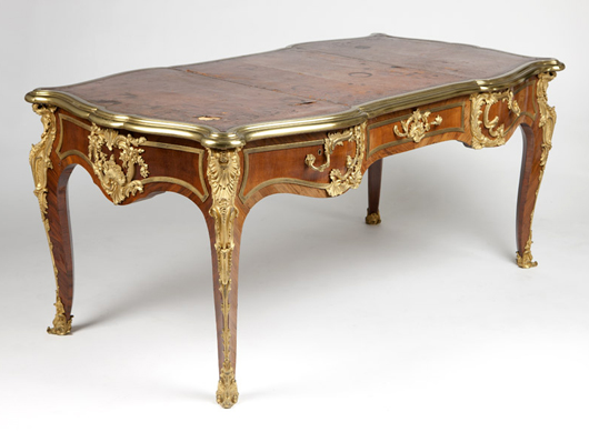This gilt bronze-mounted Louis XV-style bureau plat incited competition among floor and telephone bidders, finally going to a local buyer for $13,200 (estimate: $3,000 - $5,000). John Moran Auctioneers image.