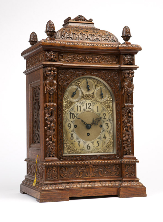 This handsome carved oak grande sonnerie bracket clock was estimated to earn $2,500 - $3,500 at the July 22 auction; it realized $3,000. John Moran Auctioneers image.