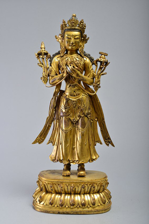 Gilt-bronze figure of Avalokitesvara on lotus base, Ming Dynasty, 23½ inches tall, purchased by a LiveAuctioneers bidder for $197,430 on May 18, 2014 at Wichita Auctioneers, New York City. Image courtesy of LiveAuctioneers Archive and Wichita Auctioneers