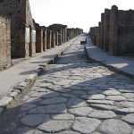 A narrow Pompeii street paved in stone. Image by Paul Vlaar. This file is licensed under the Creative Commons Attribution-ShareAlike 3.0 Unported License.