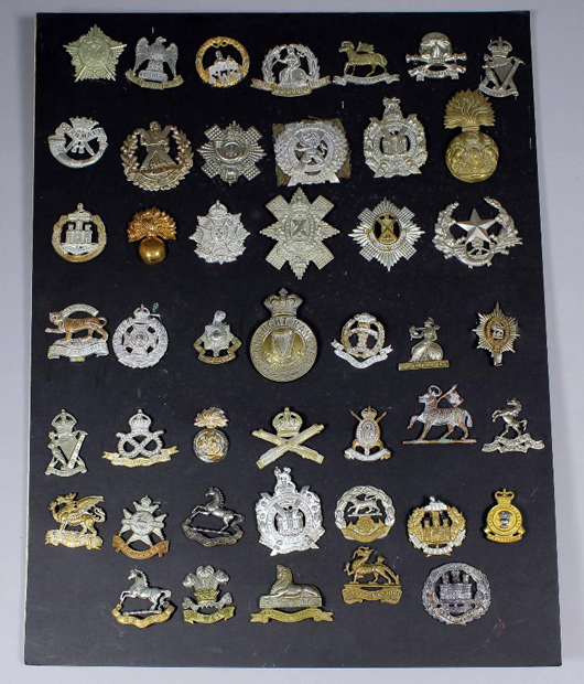A collection of military cap badges. Saleroom value: £100-150. Photo: The Canterbury Auction Galleries.
