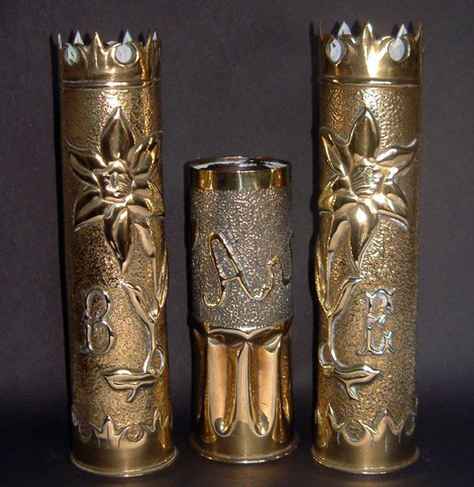 A trio of World War I trench art vases showing the elaborate and intricate designs capable of being made from shell cases. The vase in the center is inscribed in relief ‘Arras.’ Photo: private collection.