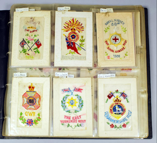 A group of World War I silk postcards, these decorated with the names and crests of various regiments - the ideal souvenir for a serving soldier to send home. A lot containing 120 sold for £540. Photo: The Canterbury Auction Galleries.