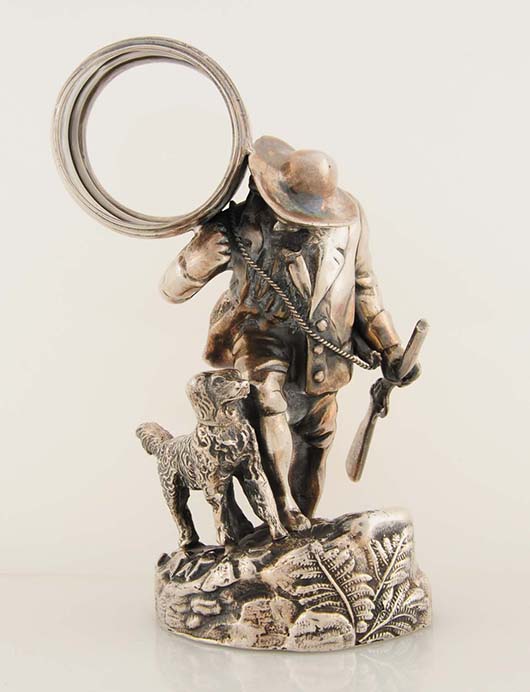 Figural napkin ring depicting Rip Van Winkle, with rifle and powder horn and accompanied by his dog. Est. $2,500-$3,500. Morphy Auctions image