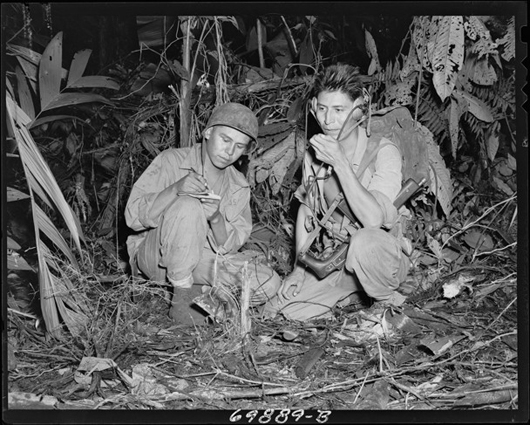 Cpl. Henry Bahe Jr. and Pfc George H. Kirk transmitting a radio message from Bougainville in December 1943. Image courtesy of Craig Gottlieb Military Antiques.