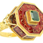 Poison rings are part of history and mystery stories. Perhaps Lucrezia Borgia murdered her foes with her ring. This 18K gold ring with a hidden compartment has red enamel trim and an emerald set in the center. Advertised as a poison ring at a 2014 James Julia auction in Fairfield, Maine. It sold for $1,185.
