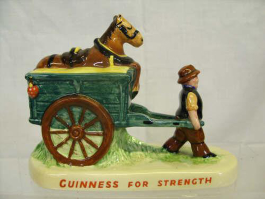 Guinness For Strength, as proved by this drayman capable of pulling his own cart with its horse as a passenger. Note the ladybird on the back of the cart. Made in about 1957, it sold for £260. Photo: The Canterbury Auction Galleries.