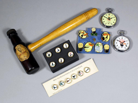 All manner of Guinness memorabilia abounds to delight collectors. This lot comprised two sets of six ‘Zookeeper Series’ waistcoat buttons, two pocket watches, lapel badges and an ingenious toastmaster’s gavel, which sold together for £130. Photo: The Canterbury Auction Galleries. 