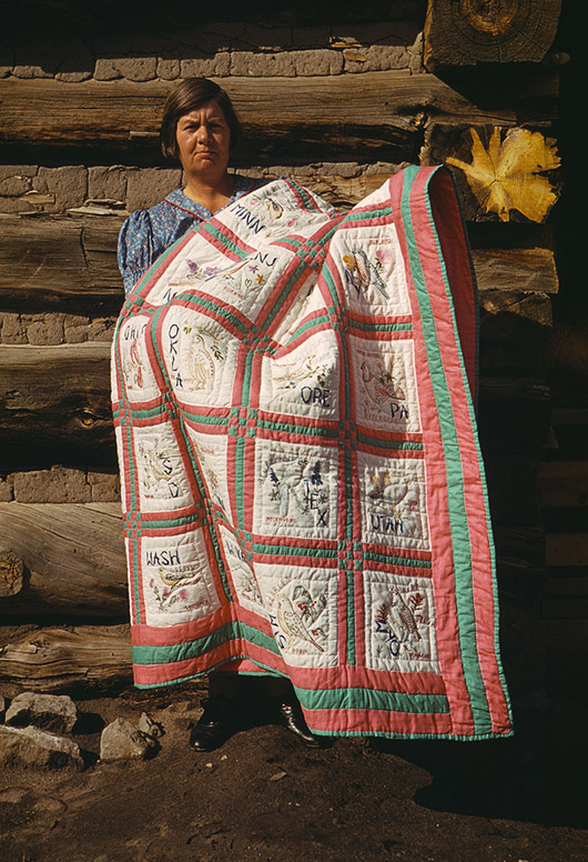  Russell Lee (American, 1903-1986) photograph of Mrs. Bill Stagg with states quilt, Pie Town, New Mexico. Russell photographed Japanese-American citizens sent to internment camps during World War II. Image courtesy of Wikimedia Commons.