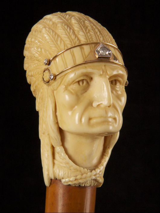 A fine ivory-handled Malacca cane the knop modeled as a North American Indian chief. His headdress has gold and diamond details, circa 1900. Photo: Michael German Antiques.