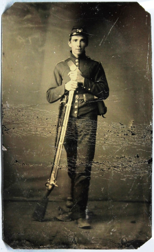 One of two tintypes of a Civil War Union soldier, possibly a sharpshooter, posed with his muzzle-loading rifle. Est.: $200-$400. Waverly Rare Books image.