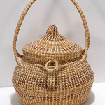Sweetgrass basket with attached lid, 17 inches tall, circa 1990s. Image courtesy of LiveAuctioneers.com Archive and Slotin Folk Art.