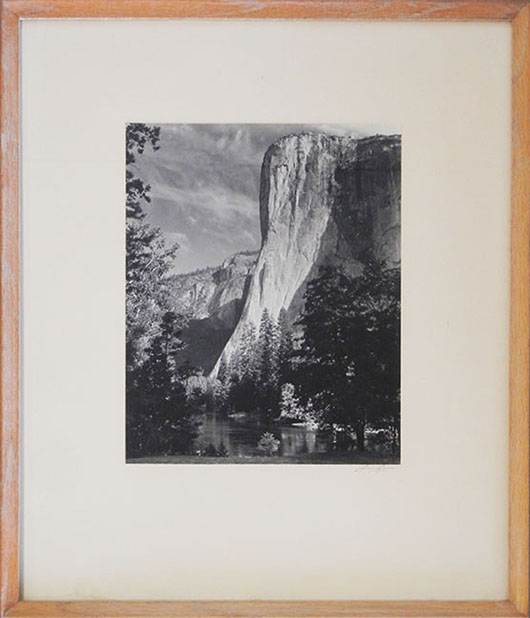 Ansel Adams (American, 1902-1984) silver gelatin print titled El Capitan, Morning – a depiction of a famous vertical granite formation in Yosemite National Park, California. Stephenson’s Auctioneers image