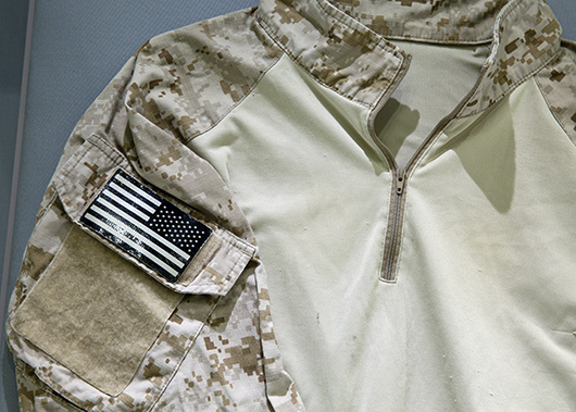 Closeup of shirt worn by US Navy SEAL Team Six member during raid on Osama bin Laden's house. Photo by Jin Lee, courtesy of 9/11 Memorial Museum