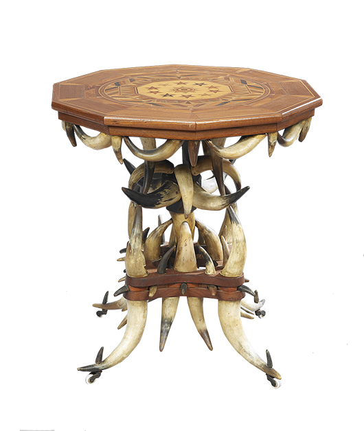 This remarkable table, made of horns in 1892, is signed W. H. T. Ehle on the inlaid wooden top. The table was made from 82 horns and is 28 inches high. Auction price at a 2014 New Orleans Auction - $9,840.