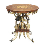 This remarkable table, made of horns in 1892, is signed W. H. T. Ehle on the inlaid wooden top. The table was made from 82 horns and is 28 inches high. Auction price at a 2014 New Orleans Auction - $9,840.