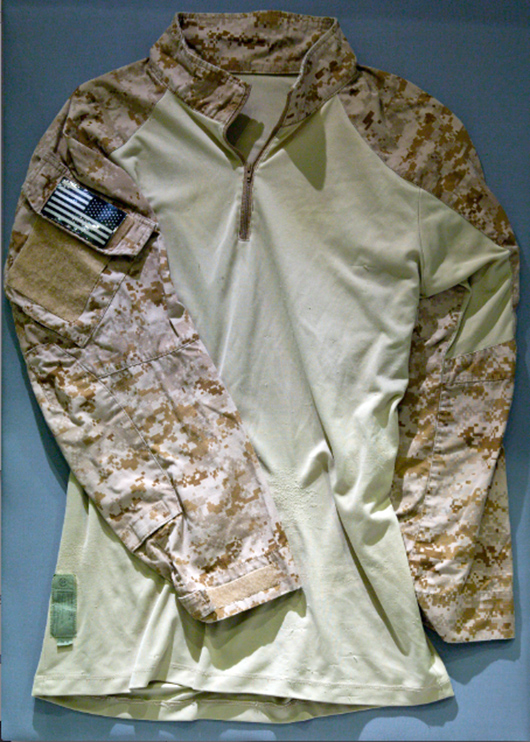 Shirt worn by US Navy SEAL Team Six member during raid on Osama bin Laden's house. Photo by Jin Lee, courtesy of 9/11 Memorial Museum