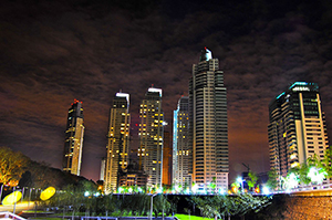 View of Buenos Aires' Puerto Madero neighborhood at night. Photo by Juan Ignacio Iglesias from Paso del Rey, Argentina. Licensed under Creative Commons Attribution 2.0 via Wikimedia Commons