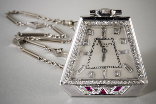 Art Deco Patek Philippe pendant watch, platinum, trapezoid-shape case with diamonds and rubies. Estimate: $ 25,000-$30,000. Capo Auction image.
