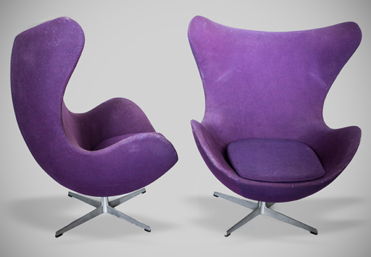Pair of purple Arne Jacobsen Egg Chairs, designed in 1958 for the lobby and reception areas in the Royal Hotel, in Copenhagen. Fritz Hansen label. Estimate: $2,000-$3,000. Capo Auction image.