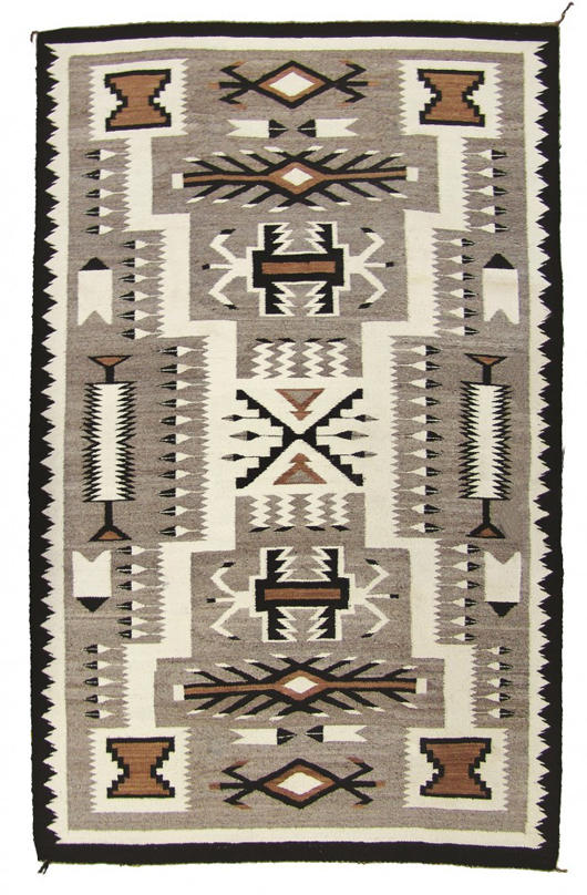 Fantastic finer weave Navajo rug in an earth-tone storm pattern with feathers, circa mid-1900s. Price realized: $3,738. Allard Auctions Inc. image.