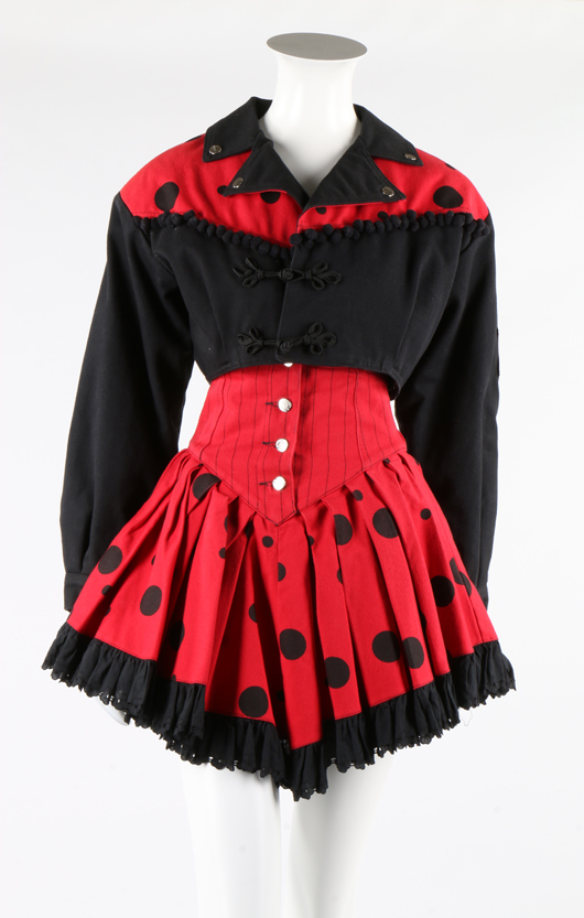 Lot 347, four colorful 1980s ensembles including this red and black denim ladybird-spot jacket and ra-ra skirt and a Victorio & Lucchino yellow and grey pleated taffeta cocktail dress with petal skirt. Estimate: £150-250. Kerry Taylor Auctions image.