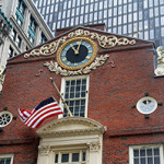 The Old State House in Boston, with the lion statue at the upper left. Image by Ingfbruno. This file is licensed under the Creative Commons Attribution-ShareAlike 3.0 Unported license.