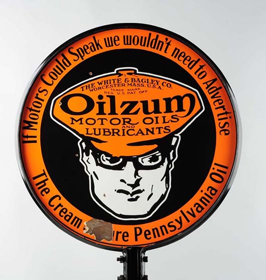 Closeup of top of Oilzum Motor Oil double-sided porcelain curb sign on stand, est. $15,000-$25,000. Morphy Auctions image