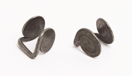 Set of spiral silver cuff links made by Calder in 1955 version. This work is registered in the archives of the Calder Foundation, New York, under application number A267 95. Keno Auctions image.  