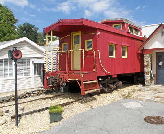 Circa-1925 B & O Railroad Model I-5 Class caboose, one of the last of the wood-bodied cabooses, est. $10,000-$15,000. Mosby & Co. image