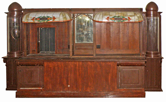 Oak bar back with rounded-glass, onion-finial side cabinets, est. $2,000-$2,500. Mosby & Co. image
