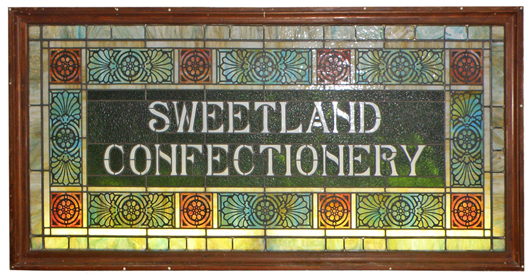 Circa-1910 stained-glass window originally from a Pennsylvania candy shop, 99 x 45in, one of a number of stained glass windows to be sold, est. 1,500-$2,000. Mosby & Co. image