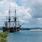 Endeavour replica anchored in Cooktown, Queensland harbor in Australia. Image by John Hill, courtesy of Wikimedia Commons.