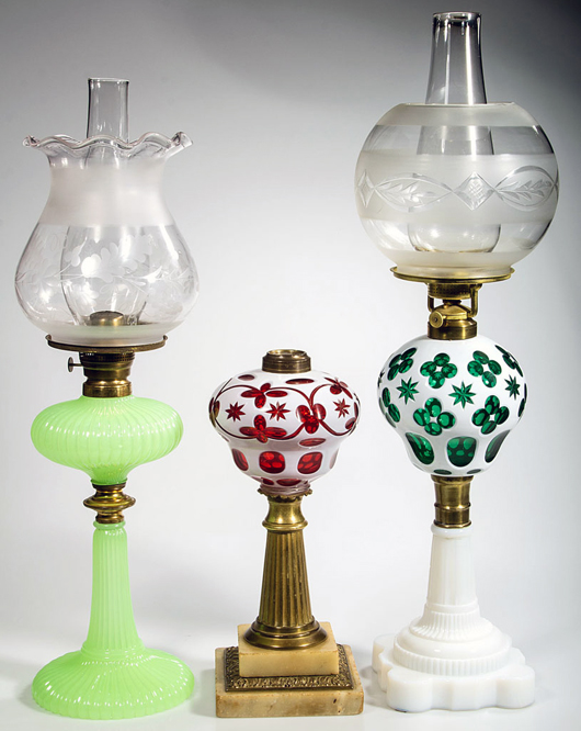 Many outstanding early kerosene period lamps including a fine Sandwich Onion and a good selection of Sandwich and other cut overlays. Jeffrey S. Evans & Associates image.