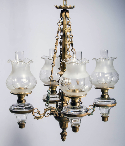 Fine Henry Hooper, Boston gilt-brass four-arm chandelier with early kerosene setups, circa 1860. Jeffrey S. Evans & Associates image.
