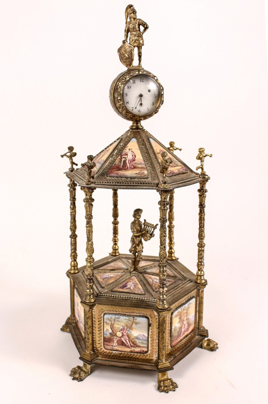 Late 19th/early 20th century Continental enamel carousel form gilt metal music box and clock with hand-painted figural scenes. Price realized: $4,000. Ahlers & Ogletree image